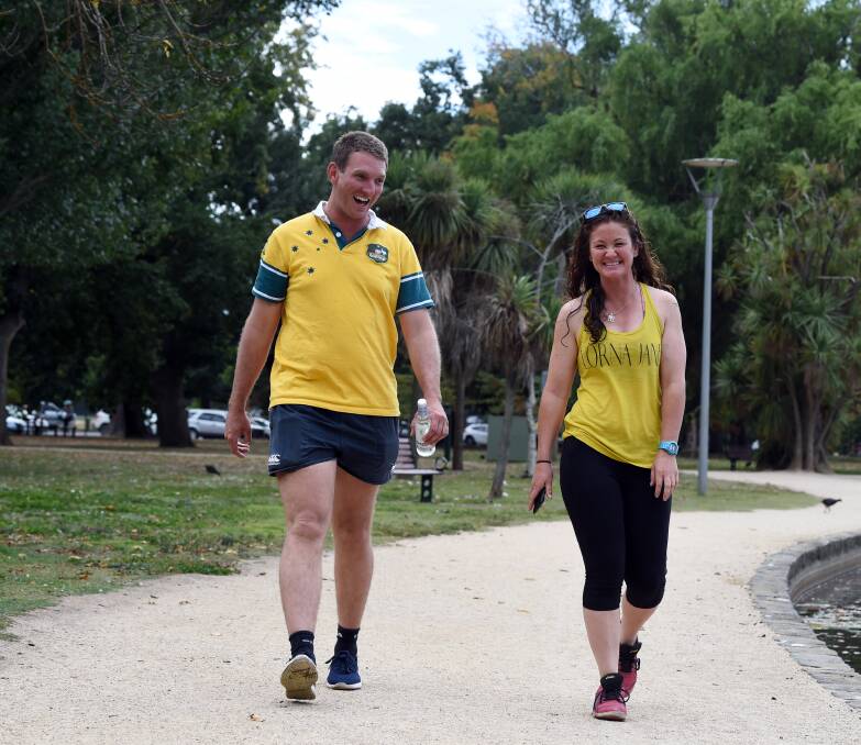 YELLOW: Monte Jackson and Shadae Boylan walk Lake Wendouree for endometriosis awareness. Picture: Kate Healy