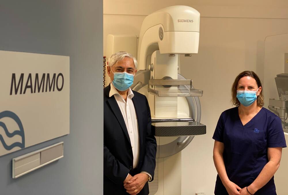 CALL OUT: Professor George Kannourakis and a Lake Imaging staff member in the clinic's mammography room. Picture: supplied