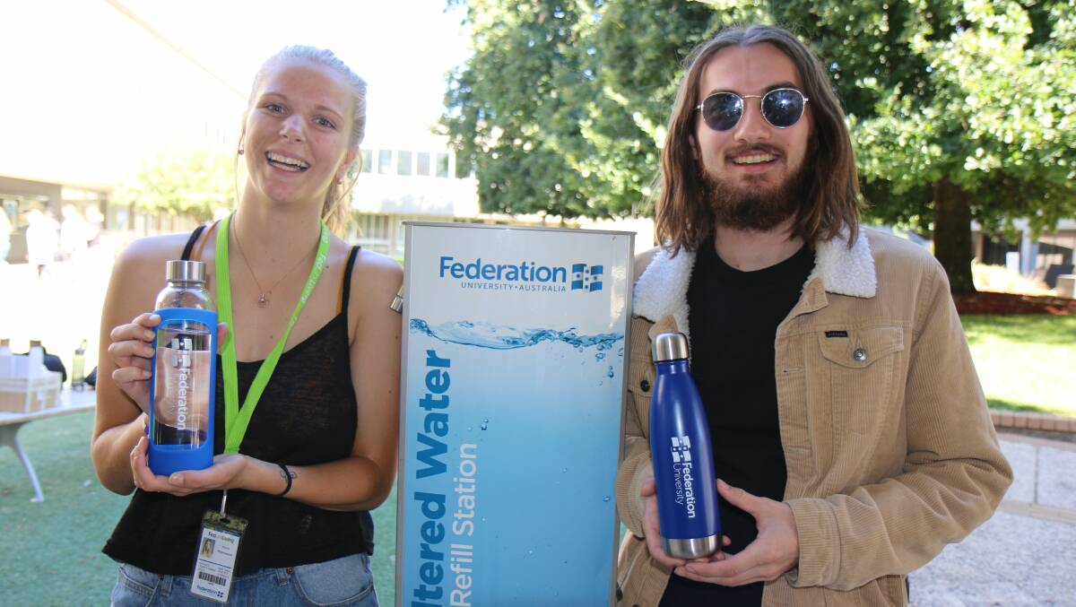 TAPPING ON: Nicole Polycarpou and Bryson West with their reusable water bottles after Fed Uni announced it would phase out sale of single-use plastic water bottles at its Victorian campuses.