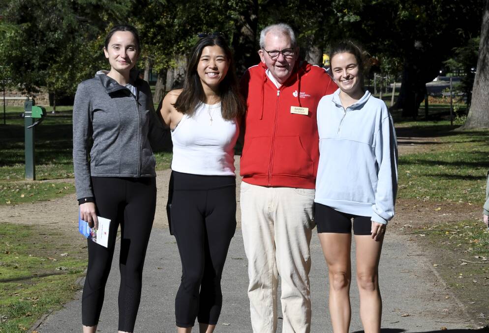 Deakin University medical students Seda Catak, Alicia Chan and Lauren Martin join Heartbeat walks coordinator Barry Nixon on one of the group's regular walks at Lake Wendouree. Picture by Lachlan Bence
