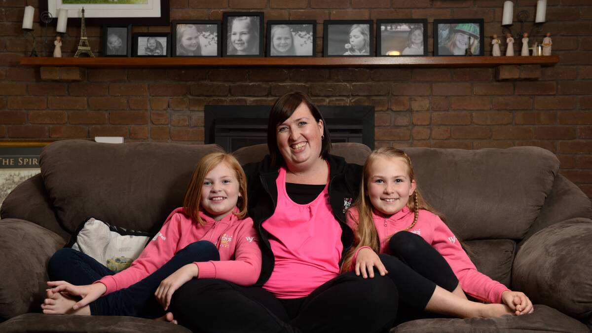 Kate Gale and daughters Bree, 9, and Gemma, 7, when she was ambassador for Mothers Day Classic in 2014.