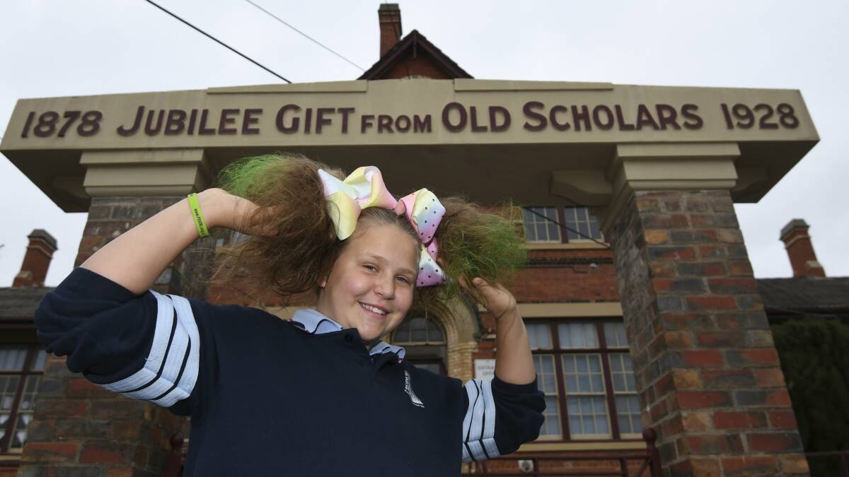 WILD: Grade six student Kira shows off her coloured pigtails during Macarthur Street Primary School's crazy hair day, raising money for FECRI. Picture: Lachlan Bence
