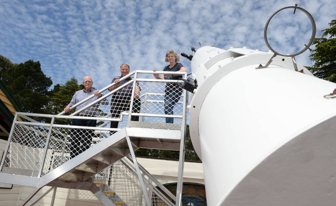 STARRY EYED: Barry Adcock (builder and curator of telescopes), Trevor Kay (committee manger) and Judith Bailey (observatory manager) on the new viewing platform for the 130-year-old Baker Telescope at Ballarat Municipal Observatory. Picture: Kate Healy 
