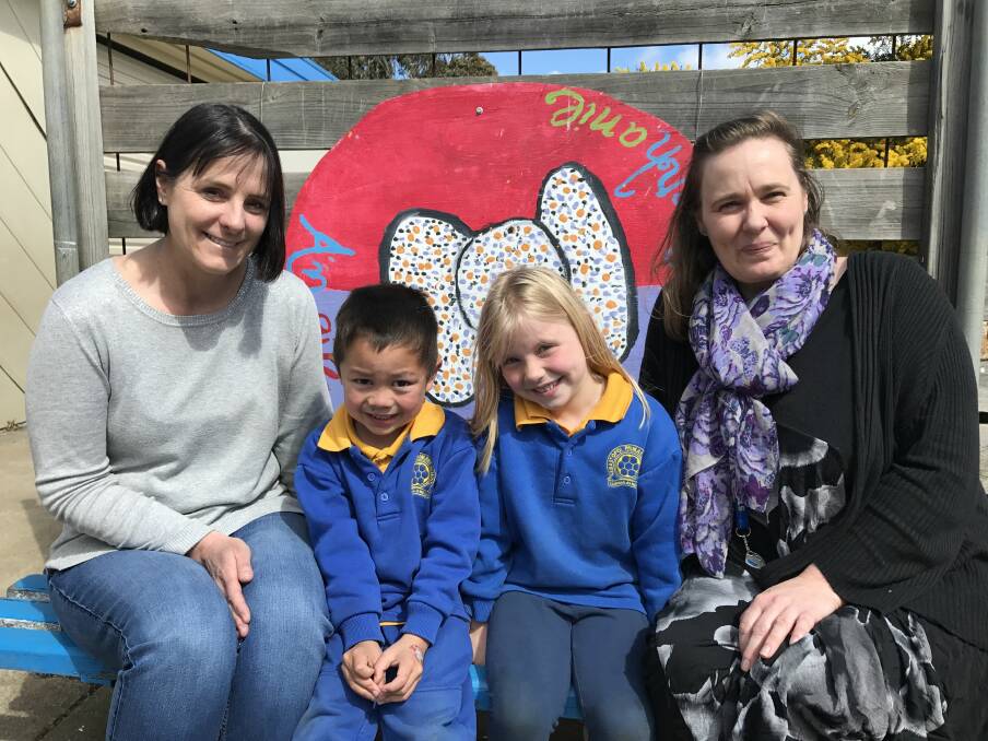 HISTORY: Sebastopol Primary School teachers Audra Lawes and Jacinta Shipham with the school's youngest pupils Dominic, 6, and Alexis, 6. The teachers were pupils at the "old" primary school when it moved to the new site 40 years ago. Picture: Michelle Smith