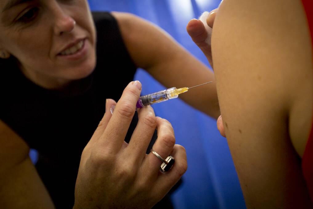 A patient receives an influenza vaccination.
