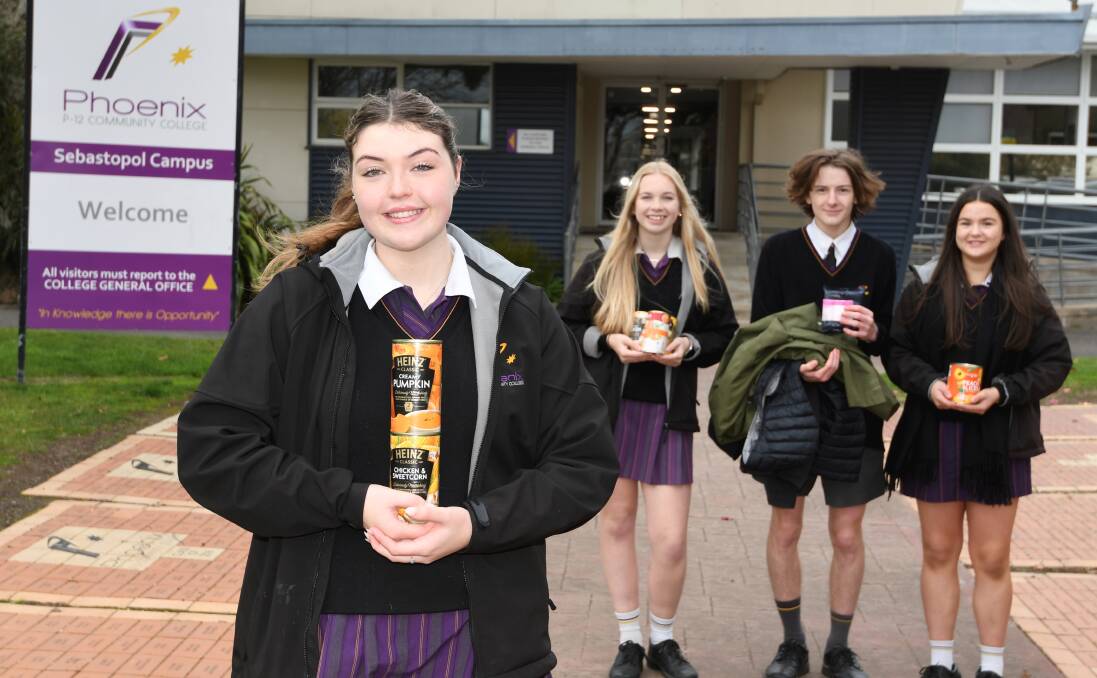 Lillian D'Arcy, Ashley Stewvens, Mitchell Brown and Bree Price with some of the items they are collecting to support vulnerable people in the community. Picture by Lachlan Bence. 