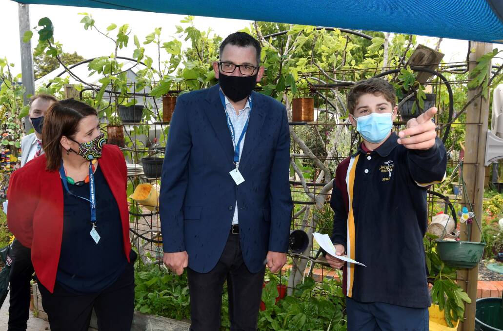 VISIT: Delacombe Primary pupil Bill leads Wendouree MP Juliana Addison and Premier Daniel Andrews on a school tour. Picture: Lachlan Bence