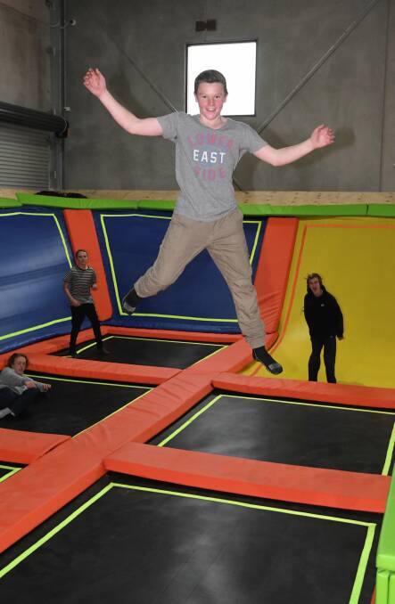 AIR TIME: Cooper James, 15, tests out the trampolines on the main court of his family's new business, Xtreme Bounce. Pictures: Lachlan Bence
