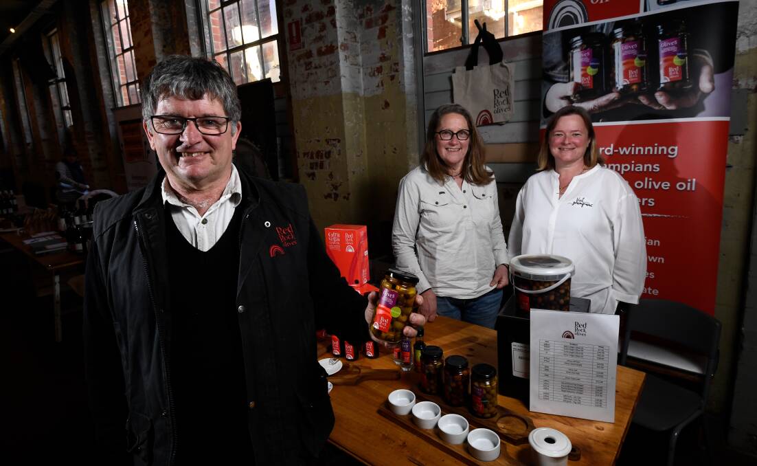 PRODUCERS: David Margetson and Rita Bikins of Red Rock Olives with Visit Grampians business manager Serena Eldridge at the launch of Eat Drink West. Picture: Adam Trafford