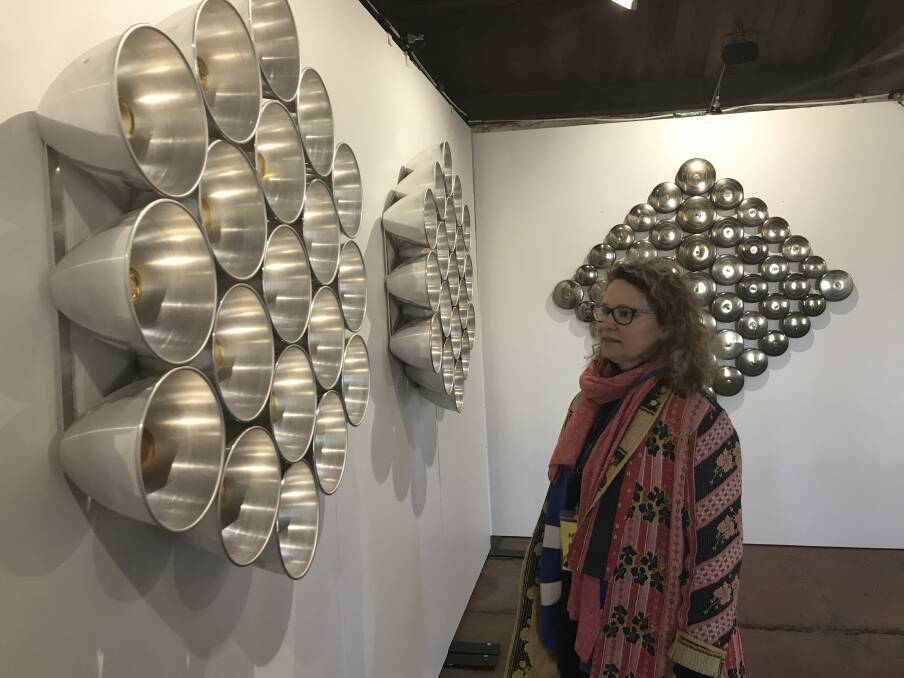 EUREKA: BOAA venue manager Felicity Martin inspects Donna Marcus' Eureka sculptures made from aluminium kitchenware. Picture: Michelle Smith