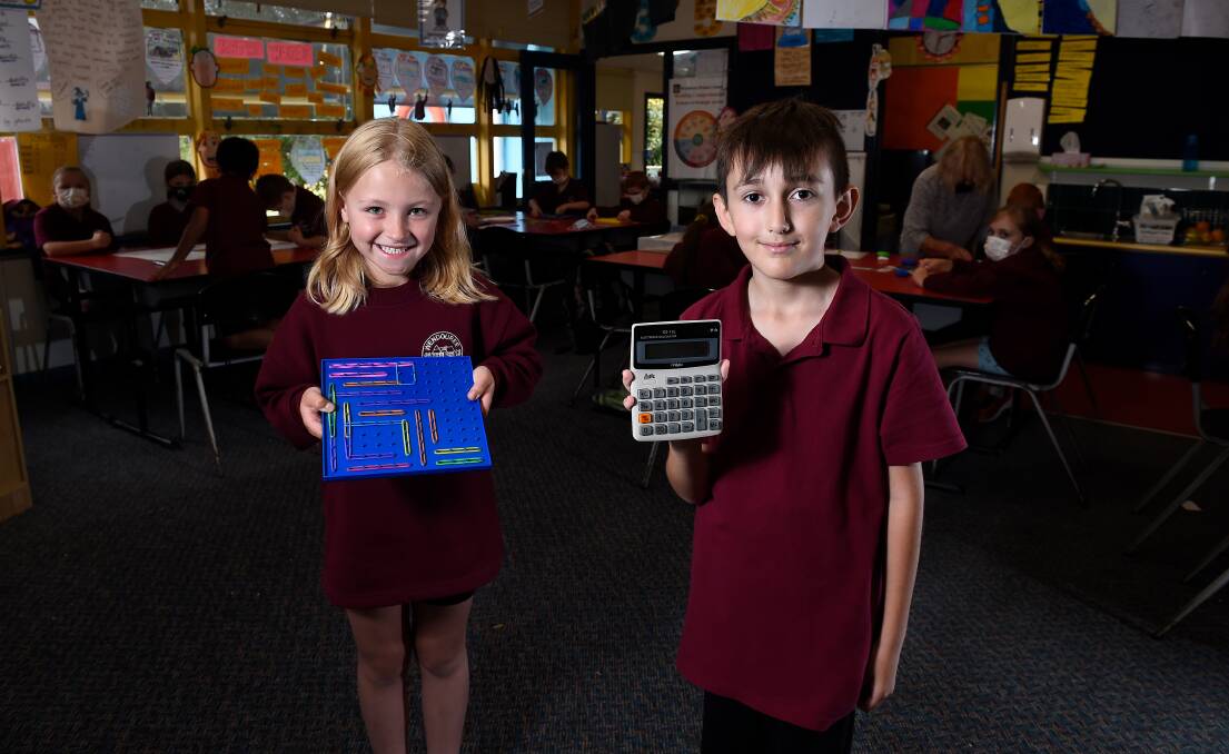 DOING THE NUMBERS: Wendouree Primary School pupils Tahlia and Lum celebrate the school's big gains in numeracy and literacy in last year's NAPLAN testing. Picture: Adam Trafford