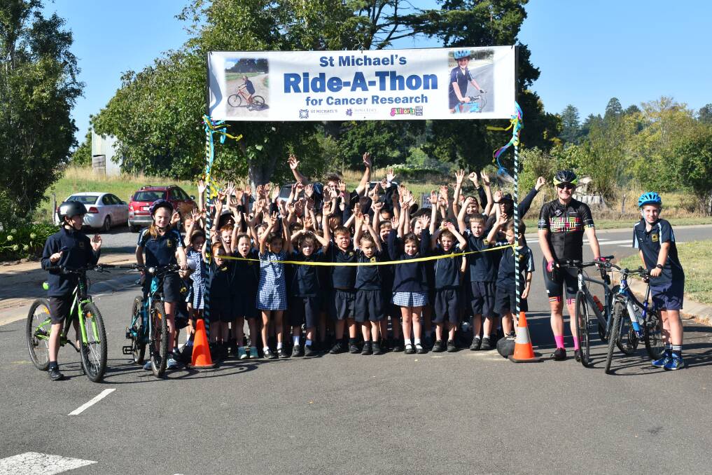 WHEELY GREAT: Pupils from St Michael's Primary School in Daylesford held a ride-a-thon, completing laps of the school's 440m driveway, to raise almost $3000 for cancer research last week. Picture: supplied 
