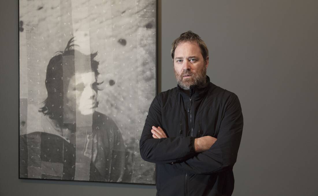 GREYS: Ballarat artist David Noonan with one of the works from his exhibition Stagecraft online at the Art Gallery of Ballarat. Picture: Jon Paley