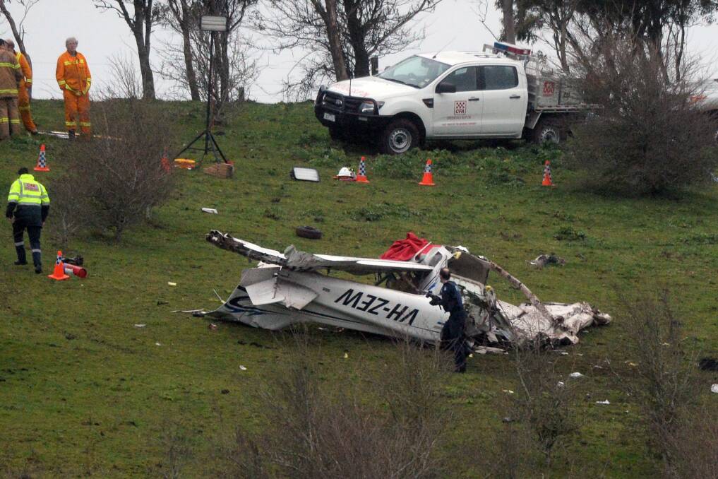 NO ANSWERS: Rescue workers and police at the scene of the fatal plane crash at Black Hill, near Gordon, in September 2015. Picture: Kate Healy