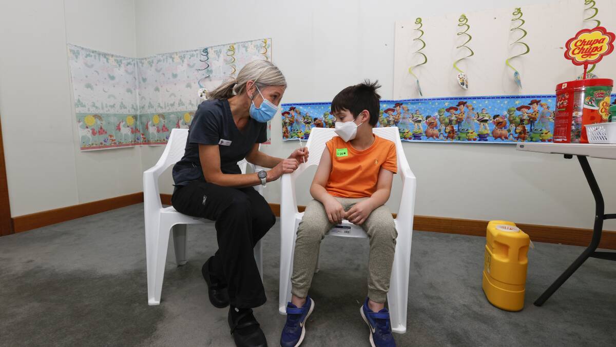 JAB: Nurse Sarah Brennan reassures Anthony Ainio, 7, who got his first COVID-19 vaccination at the UFS vaccination clinic on Monday. Pictures: Luke Hemer .
