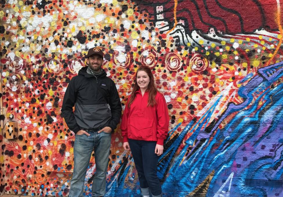 SPRAY ART: Artists Paul Round and Sarah Barclay in front of a colourful mural spray-painted on a building in Beverin St, Sebastopol, as part of a state government funded program to beat graffiti. Picture: Michelle Smith