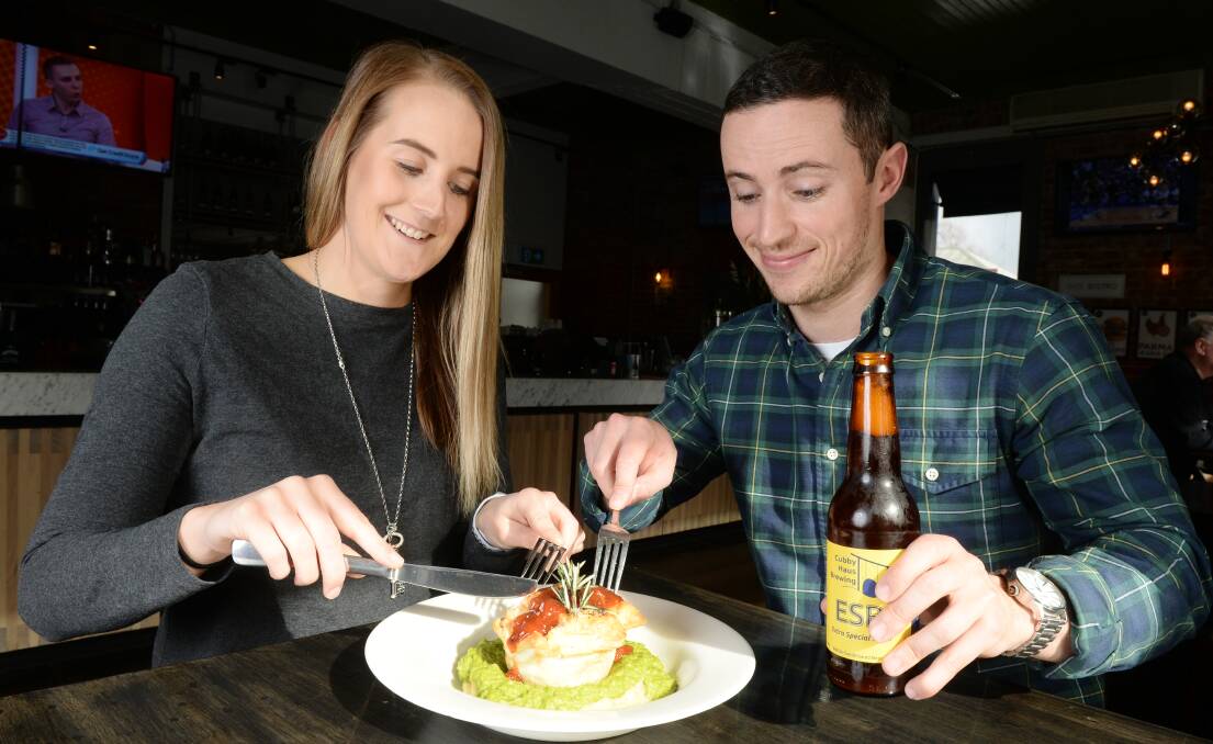 PIE-EYED: Tiarni Beasley and  Sam Palanca sample The Western Hotel's slow-cooked Waubra lamb pie on a bed of creamy mashed local potatoes with mushy peas. Picture: Kate Healy