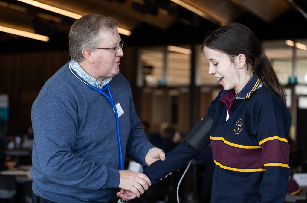 FUTURE: Nurse Barry Flynn and student Isabelle Stout at the Damascus College STEAM Expo. Picture: Luke Hemer