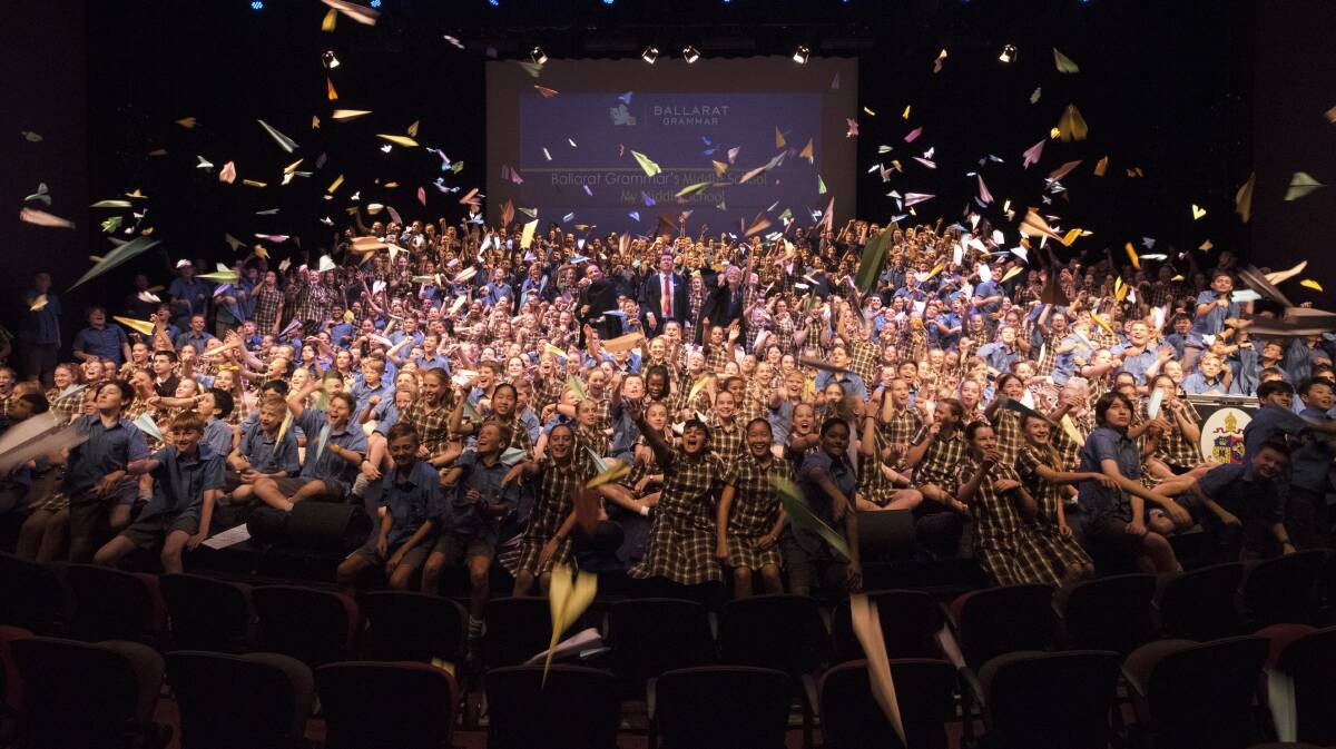 LAUNCH: The 475 students of Ballarat Grammar's new middle school symbolically launch hundreds of paper planes to mark the start of a new era at the school.