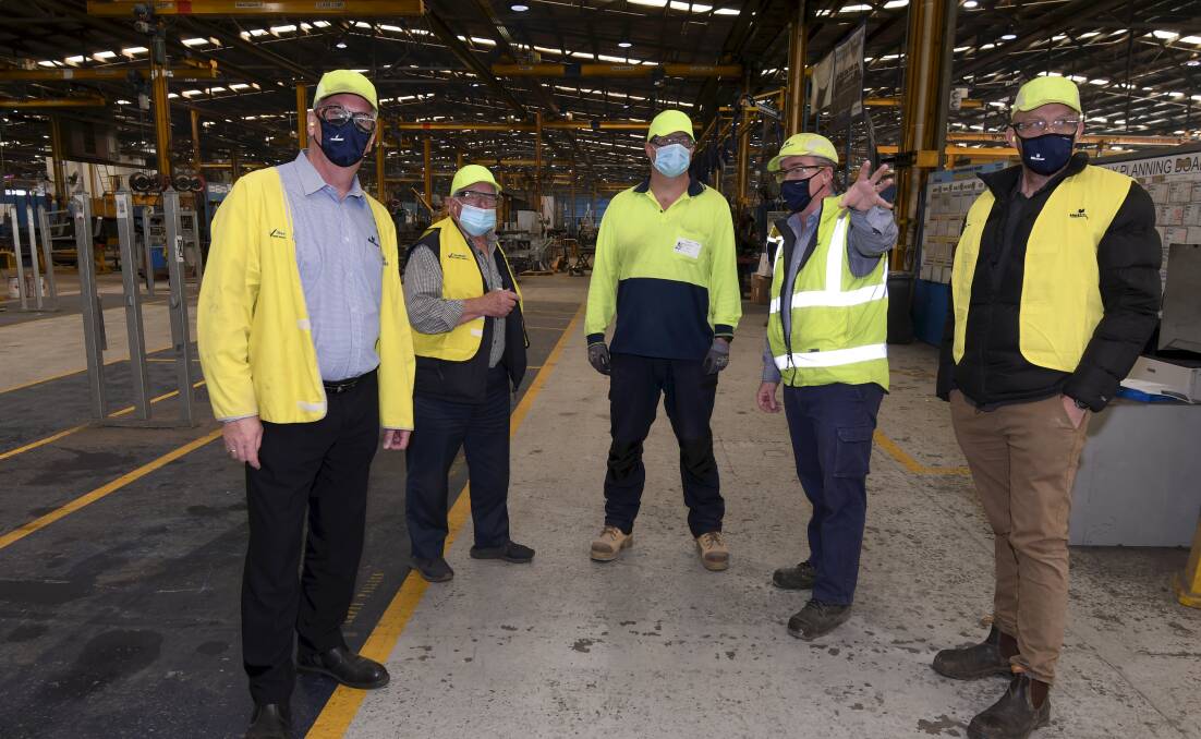 FACTORY: MaxiTRANS supply manager Anthony Long, Geoff Russell and Russell Schoenfielder from BRI, MaxiTRANS' Chris Liston and McCallum executive manager employment Adam Bogers. Picture: Lachlan Bence
