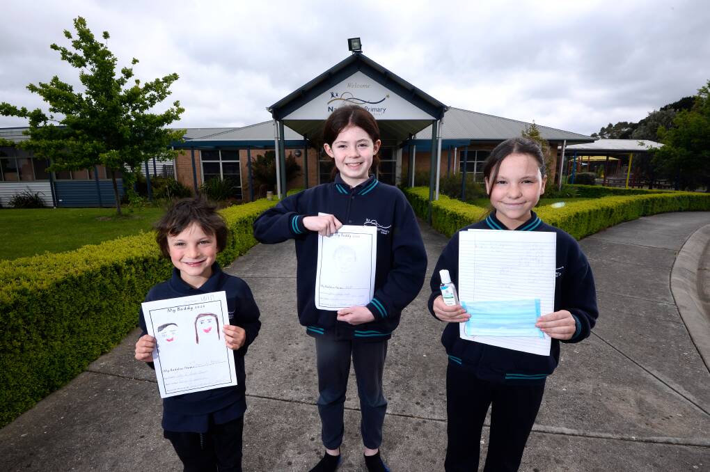 FUTURE: Will, Harrison and Maggie with some of the items they have prepared to go in the time capsule to give future Napoleons Primary School families a taste of school life in 2020. Picture: Adam Trafford