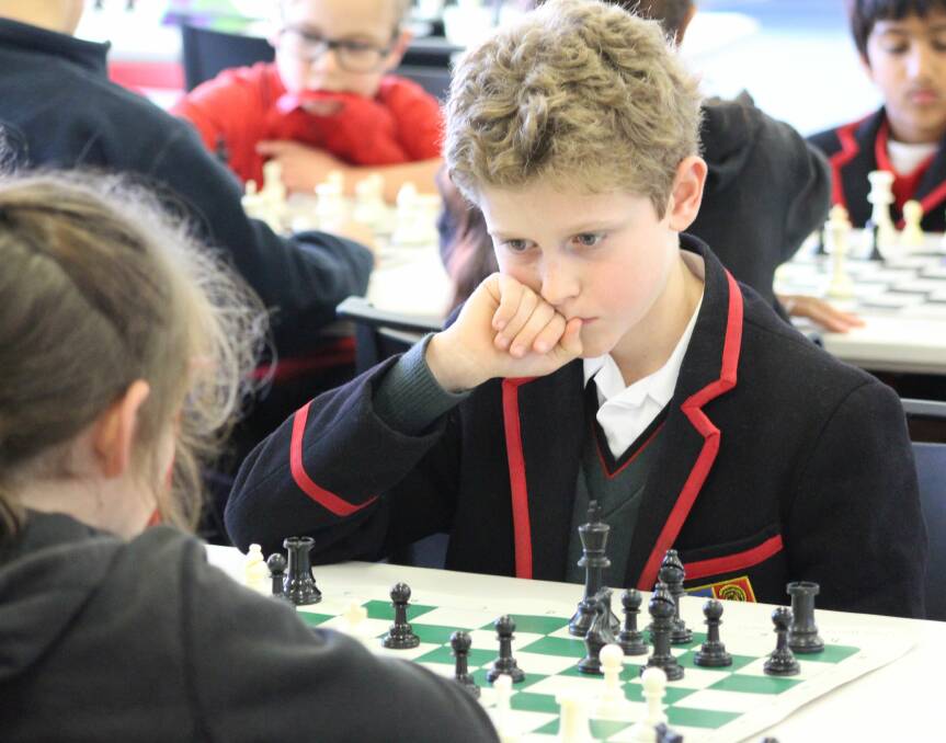 CONCENTRATION: Grade five pupil Frederick Finch contemplates his next move during the Regional Chess Championships, which saw more than 160 students from nine schools compete at Ballarat Clarendon College this week for a place in the state finals.