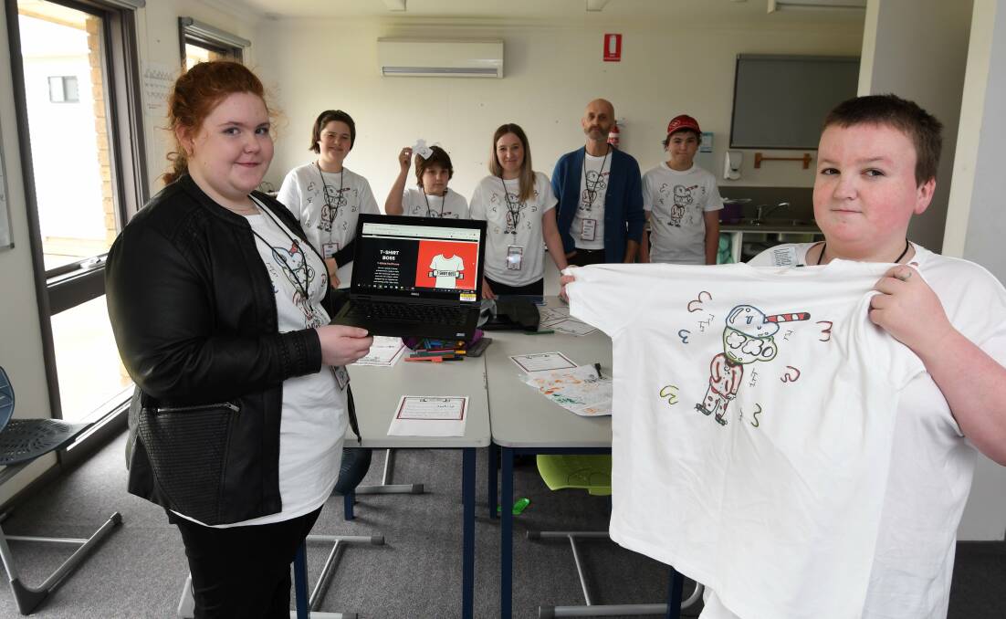 SHIRTS: The T-Shirt Boss company at Berry Street School with their t-shirts and website. IT whiz Laura and designer Toby at front with Eloise, Brodie, teachers Samantha Walkerden and Pete Walker, and Jai. Picture: Lachlan Bence