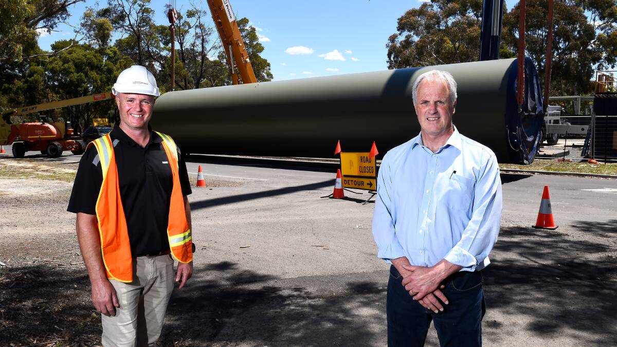 READY: Keppel Prince project supervisor Leigh Cleary and Federation TAFE manager sales, marketing and engagement Bill Mundy with the wind turbine training tower. Picture: Adam Trafford
