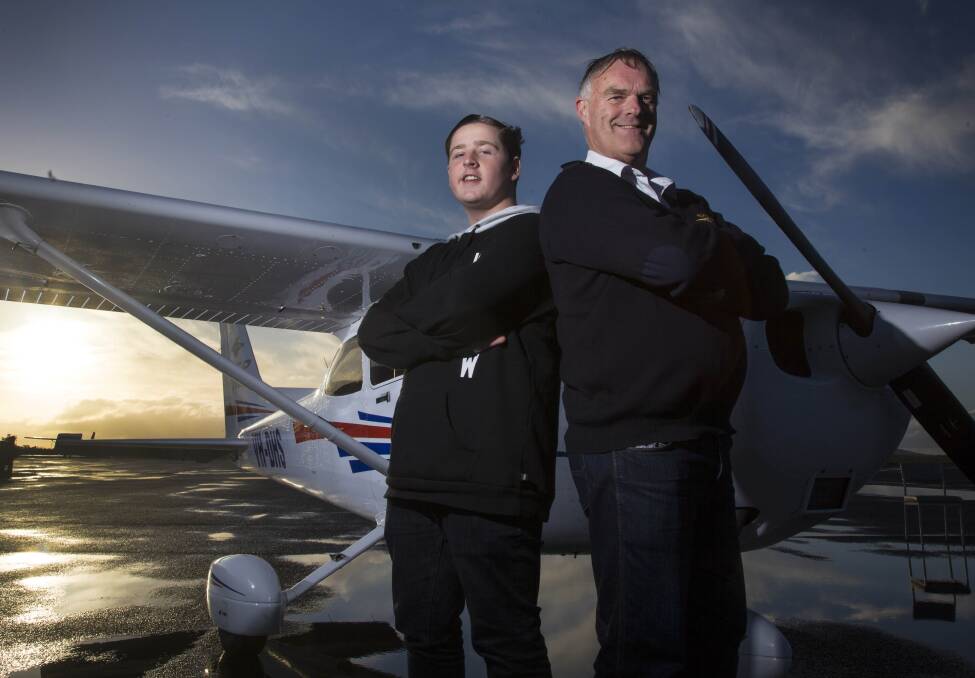 FLYING HIGH: Ballarat Aero Club student pilot Xavier Thomson-Newbury and chief flying instructor Reg Phillips celebrate the aero club regaining general aviation training approval. Picture: Mark Smith