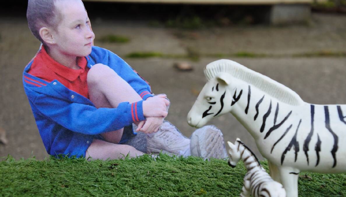 Zebras inhabit a miniature landscape artwork