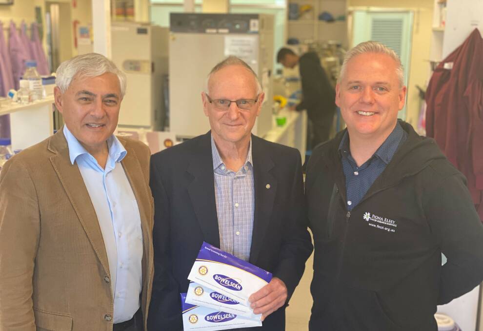 FUNDING: FECRI director Professor George Kannourakis, Rotary representative Barry Stokes and FECRI researcher Jason Kelly with the Rotary Bowel Scan kits, sales of which raise money for bowel cancer research. Picture: supplied