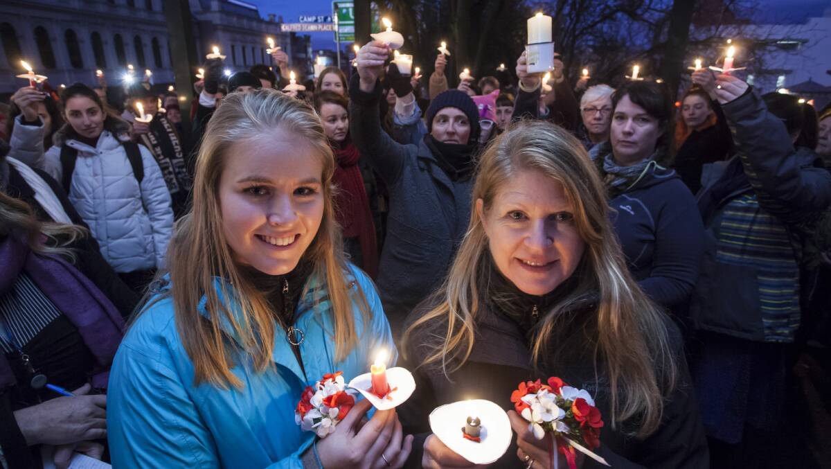 CANDLES: Sarah and Janet Robinson were among hundreds taking part in a vigil to remember murder victim Eurydice Dixon. Picture: Mark Smith