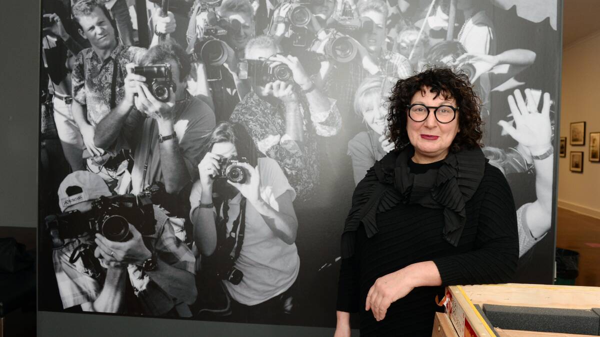 RETROSPECTIVE: Former Ballarat International Foto Biennale artistic director Fiona Sweet with an image from the Linda McCartney: Retrospective exhibition at the Art Gallery of Ballarat. Picture: Kate Healy