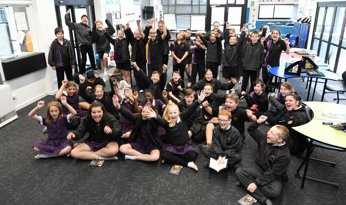 EXCITED: Phoenix P-12 Community College grade 5/6 students are enjoying a brand new building on the secondary school campus, which they moved in to at the start of term two, as the school's population continues to soar past 1300 students. Picture: Lachlan Bence