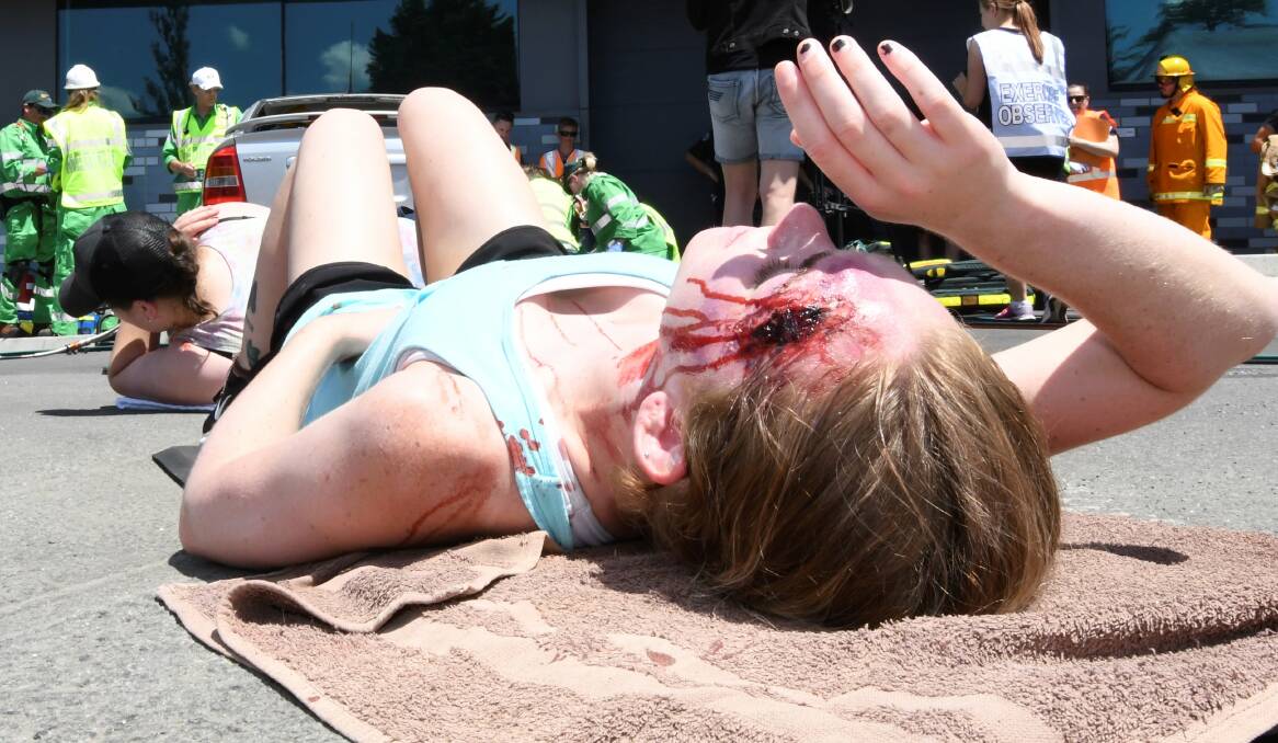 VICTIM: Students from other ACU courses volunteered to play the victims of the attack, complete with grotesque make-up to emphasise the reality of the scenario.