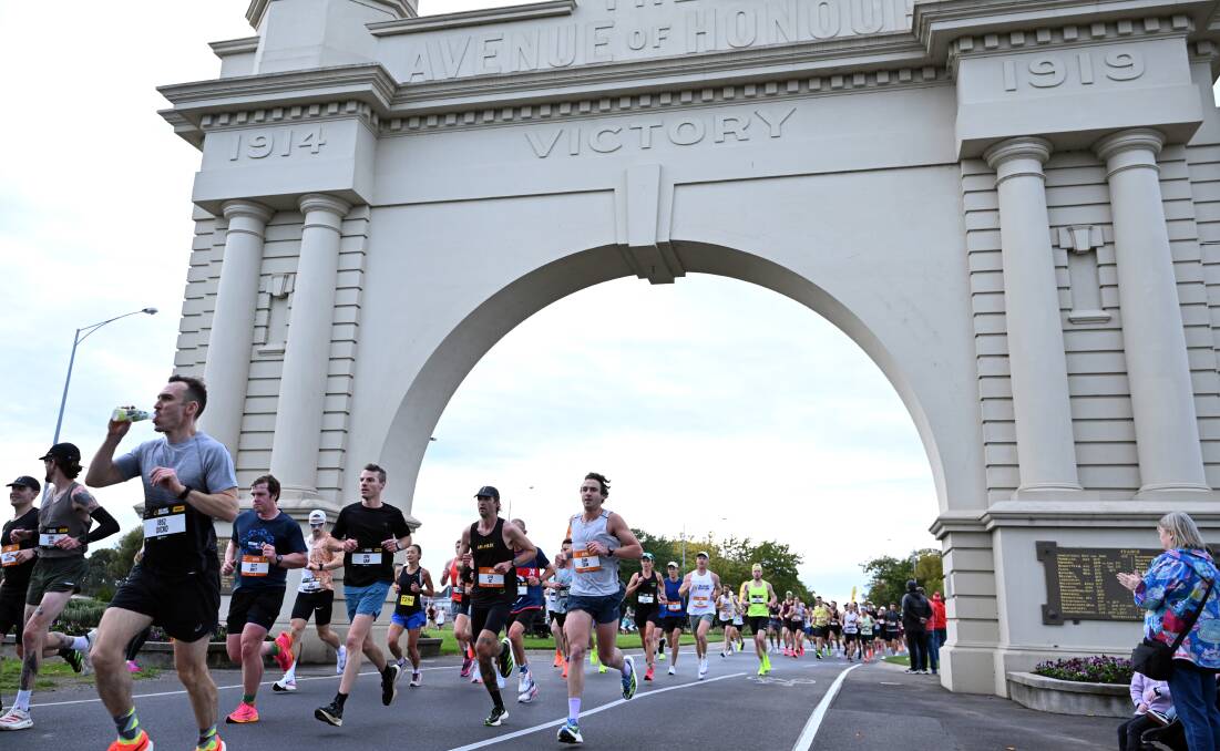 Runners make their way through the Arch of Victory during the Ballarat Marathon on Sunday. Picture by Kate Healy