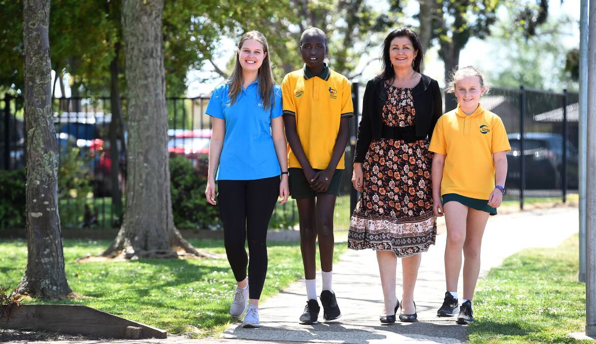WALKING: Alfredton Primary pupils Tesloach (left) and Sienna with Emma Gittus from Bicycle Network and Ballarat mayor Samantha McIntosh during an Active Travel workshop, part of VicHealth's Walk to School month. Picture: Adam Trafford