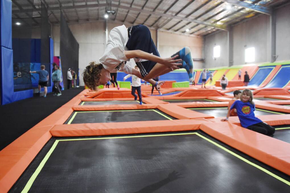 JUMP: Delacombe's Thomas Ladd, 12, goes head over heels as he somersaults on one of the 78 trampolines at the Xtreme Bounce trampoline park. Picture: Kate Healy