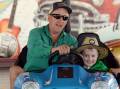 Clunes residents Rob Anderson and Benji Anderson, 6, enjoy a spin on the dodgem cars at the Clunes Show on November 18. Picture by Kate Healy
