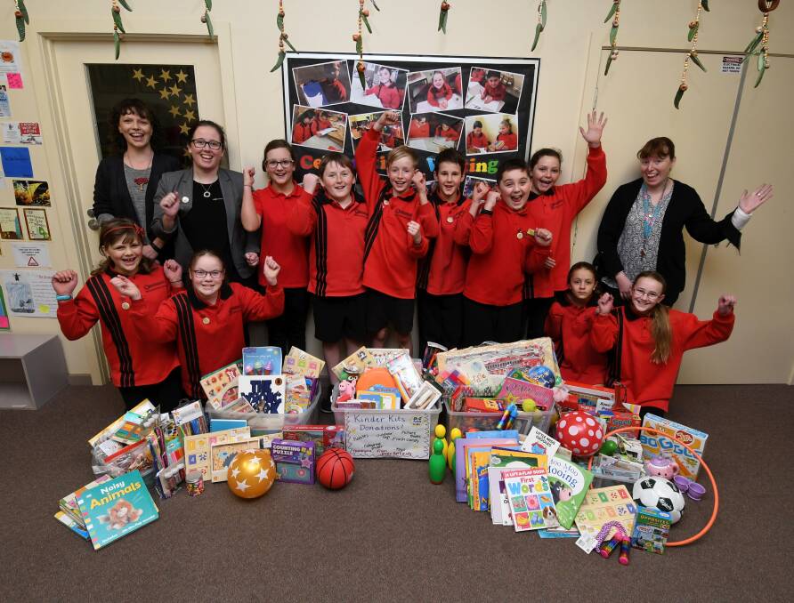 SERVICE: Some of the RotaKids team, and their supporting teachers, from Ballarat North Primary School with their donated school supplies. Picture: Lachlan Bence