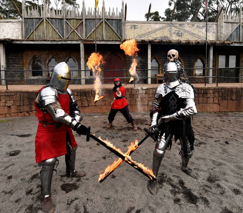 FLAMES: Sir Hector (Cliff Formosa), Cicero the Fire Eater (Matthew Keating) and The Black Knight (Phillip Leitch) battling with fiery swords before last year's Knights of Fire at Kryal Castle. Picture: Jeremy Bannister
