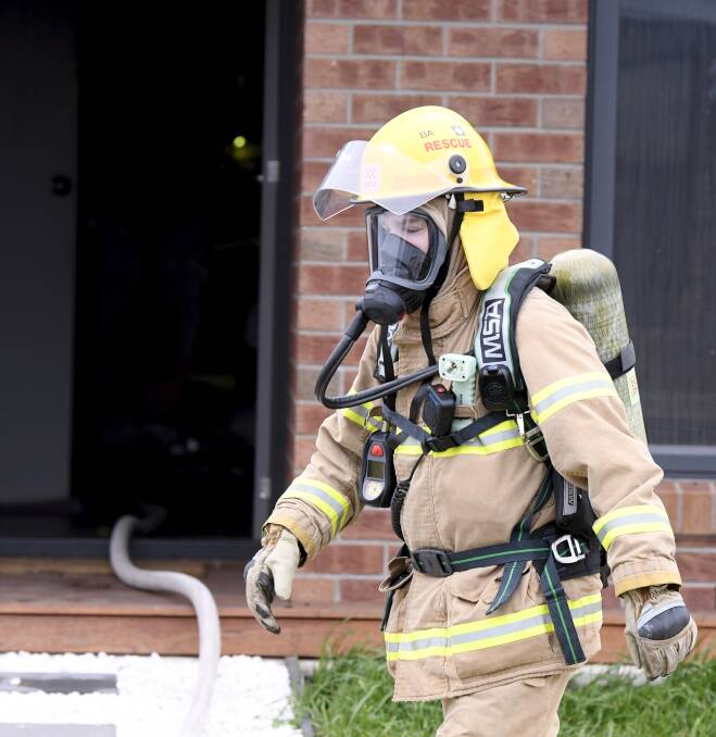 A CFA firefighter on scene at the blaze which badly damaged Sam Lehmann's Bonshaw home. Picture: Lachlan Bence