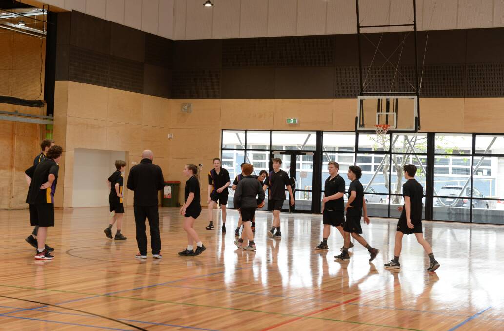 HOOP TIME: Phoenix P-12 College students test the school's new basketball court which, along with two more promised by education minister James Merlino, will also be used by Basketball Ballarat and the wider community. Picture: Kate Healy