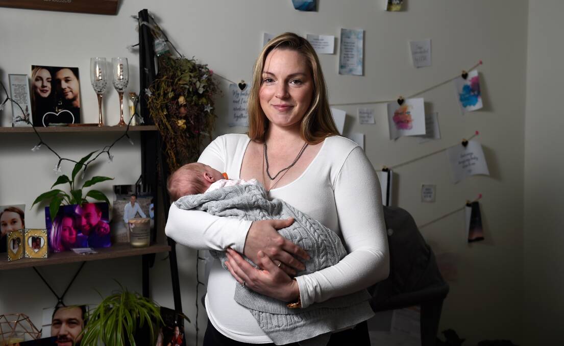 FAMILY: Cassandra Hall cradles two-week-old Isabelle in her arms as she adjusts to motherhood at their Ballan home. Picture: Adam Trafford