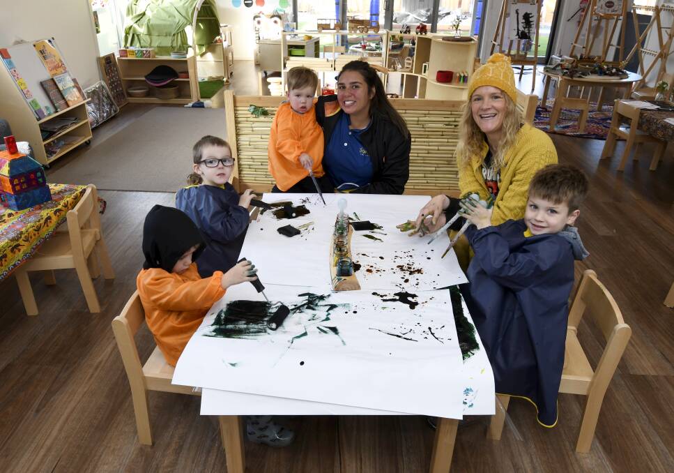 CULTURE: Peter, 3, Kobe, 4, Ned, 2 and Ben, 4, get creative at Yirram Burron Early Learning in Sebastopol with staff Ashleigh Moore and Joan Maule. Picture: Lachlan Bence