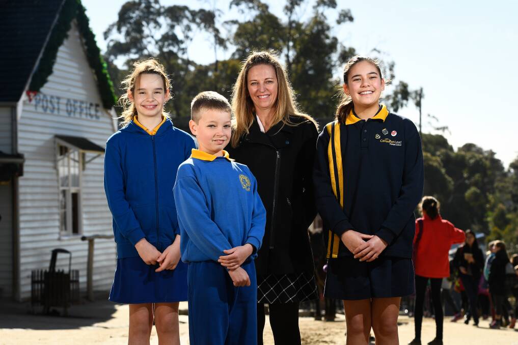 INSPIRATION: Rory from Woady Yaloak PS - Ross Creek, Brayden -from Sebastopol PS, and Philippa from Canadian Lead PS with Woady Yaloak teacher Jo Angel at the Ballarat Young Authors Program day at Sovereign Hill. Picture: Adam Trafford