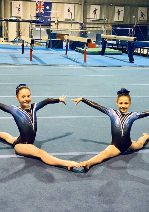 Isabelle Long, 11, and Isabelle Kis, 8, want their Eureka Gymnastics Club reopened so they can start training again. 