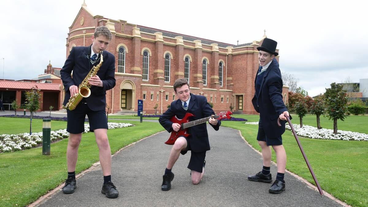 James Shaw, Oscar Eldridge, Joel Ballesty celebrate the announcement of state funding for the St Patrick's College performing arts centre in 2020.