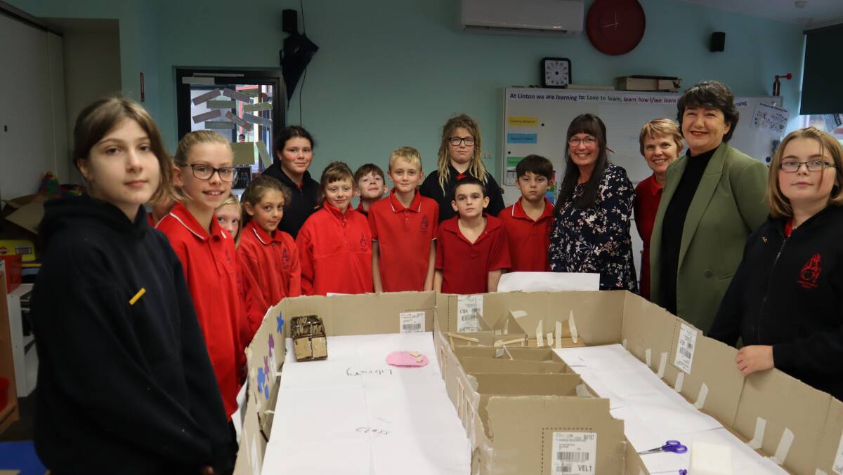 PLANS: Linton Primary School pupils, staff and local MP Michaela Settle with a model of the school redevelopment. 