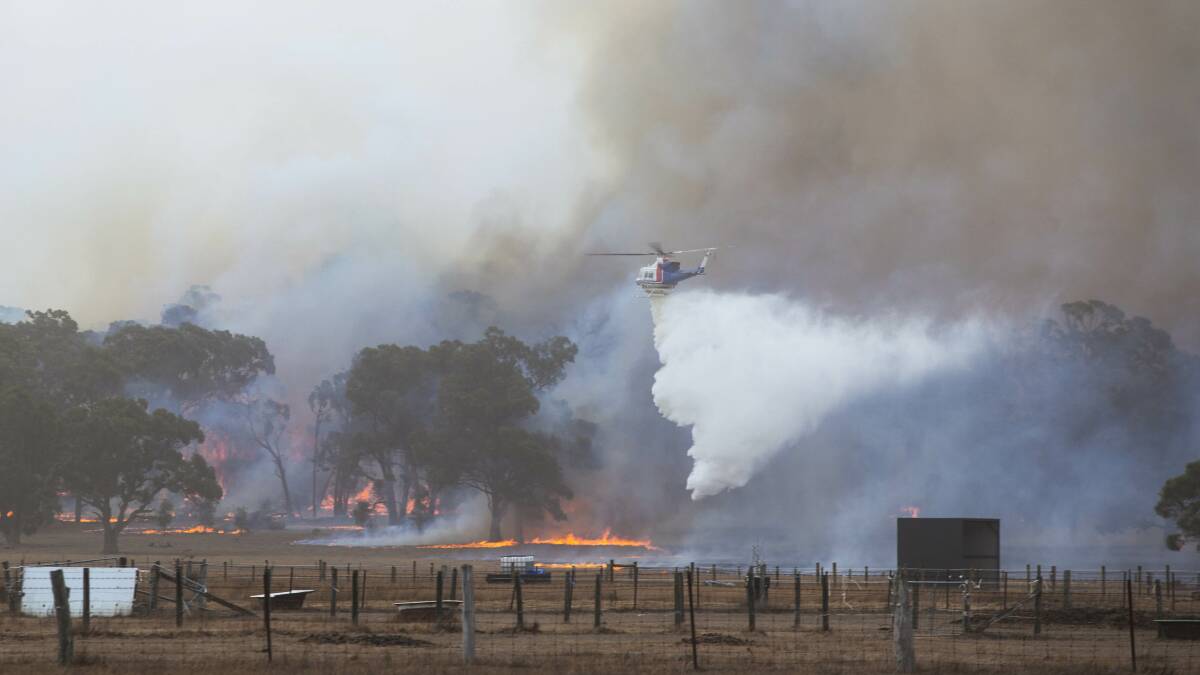 The firefight came from the ground and from the air at the Bunkers Hill blaze last month. Picture: Mark Smith